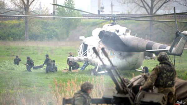Rebels Down Ukraine Helicopters,  Putin Denounces City Assault