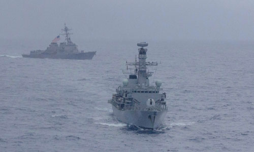 US Warships Sail Through Disputed South China Sea as Trump Prompts Trade War Escalation with Beijing