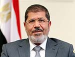 Egypt's president urges Syrian regime to go, warns Iran to stay out of Arab affairs